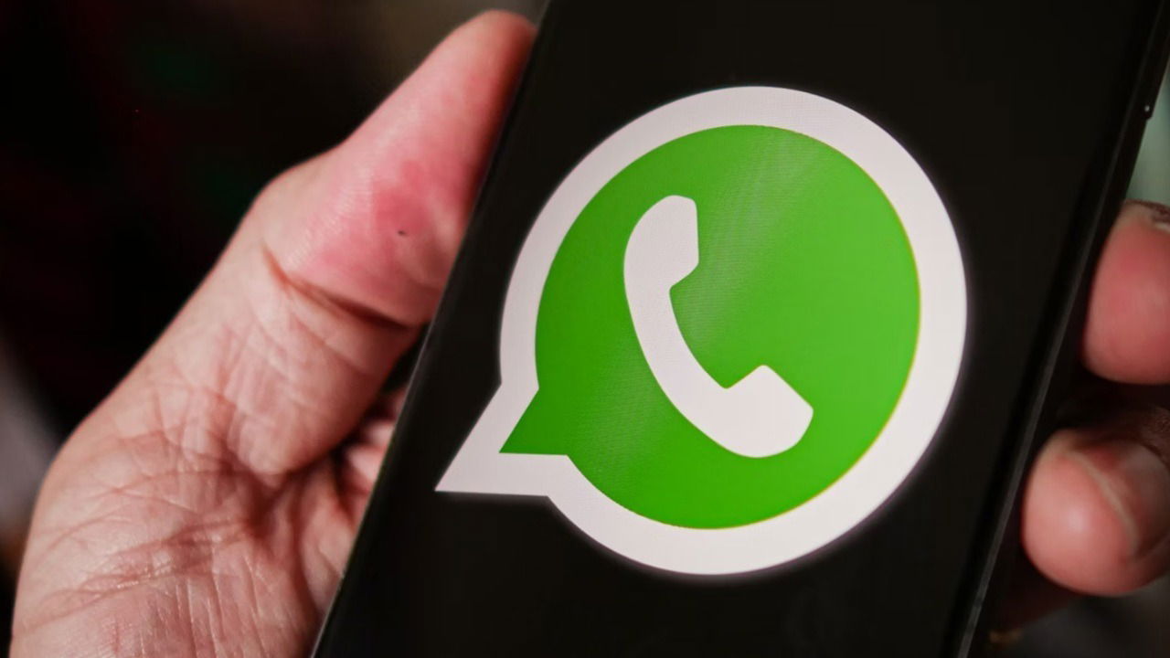 WhatsApp logo on phone.