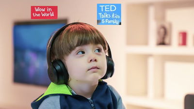 A Kid listening to podcast with earphones