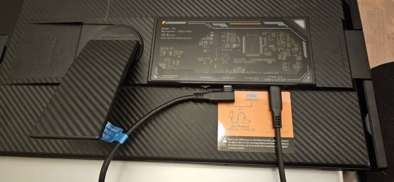 Kickstand on back of monitor.