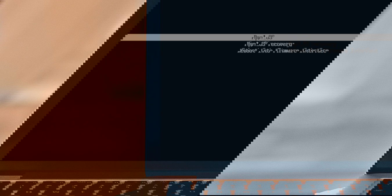 A photograph of a laptop showing a Systemd-boot bootloader.