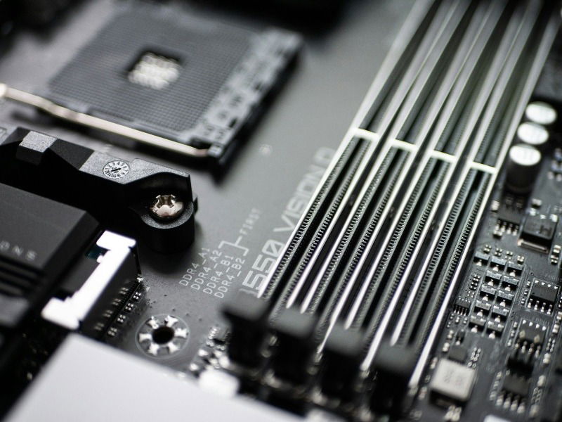 Close-up of a computer motherboard showing RAM slots