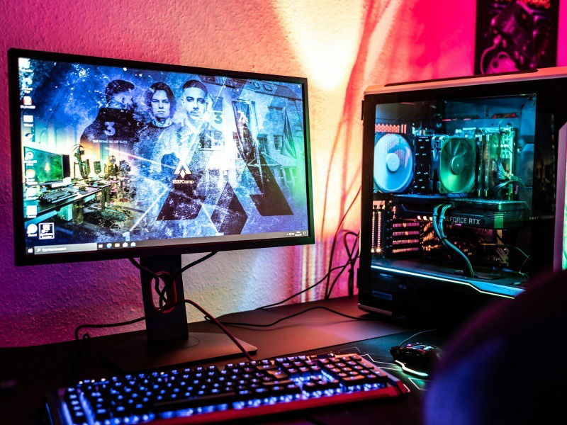 A gaming PC setup showing a PC, monitor, keyboard, and mouse