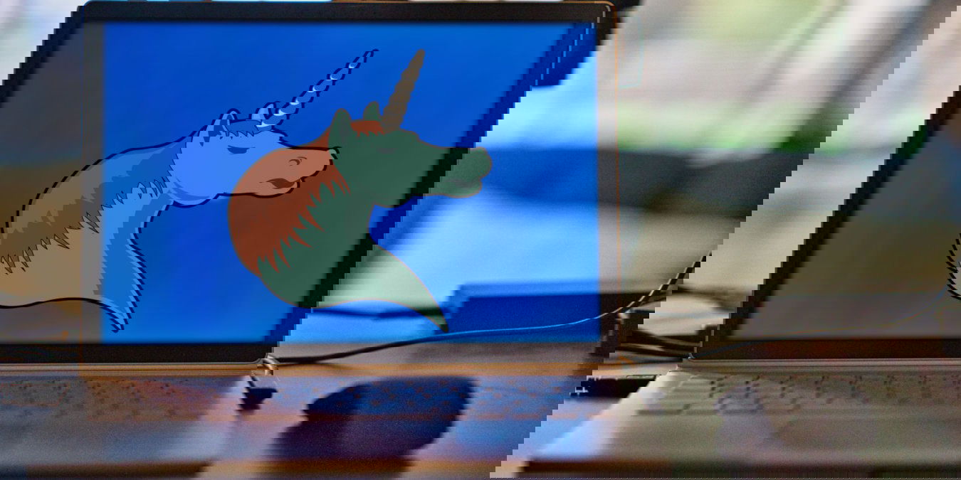 A photograph of a laptop with a blue screen.