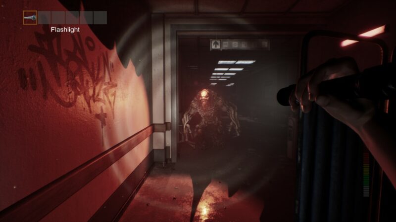 A screenshot from the game Panicore, showing a hallway, a terrifying humanoid monster, and the player in first-person view holding up a flashlight at it.