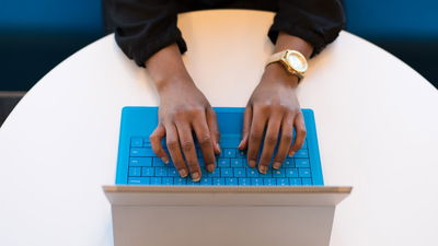 Man Using Microsoft Tablet For OneNote
