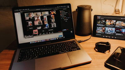 A Zoom meeting displaying the chat section on a laptop.
