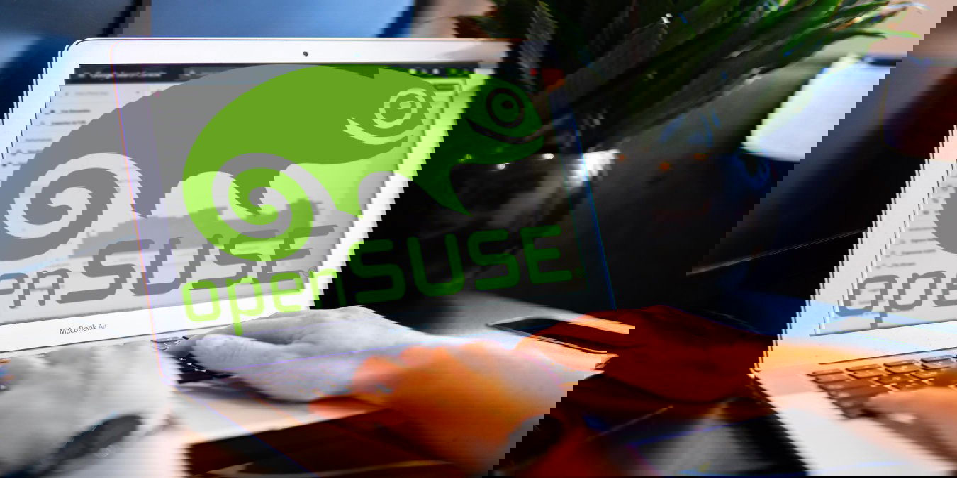 A photograph of a person using a laptop.